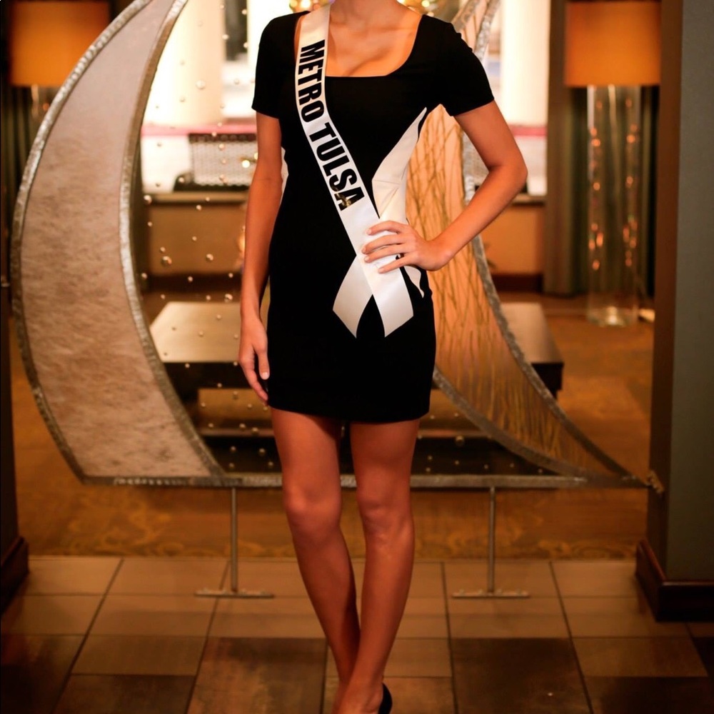 Elegant flattering black dress with white leather